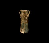 Roman Double Unguentarium
2nd century AD. An iridescent glass double unguentarium with applied trails to the upper body, applied loop handles. 51 gra...
