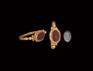 Roman Gold Ring with Fascis Gemstone
1st century BC. A carnelian intaglio fascis symbolic axe of juridical authority in a cell with beaded wire borde...
