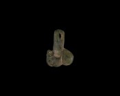 Roman Phallic Pendant
1st century AD. A bronze pendant comprising a square-section phallus with flanking D-shaped testes, pierced suspension lug abov...