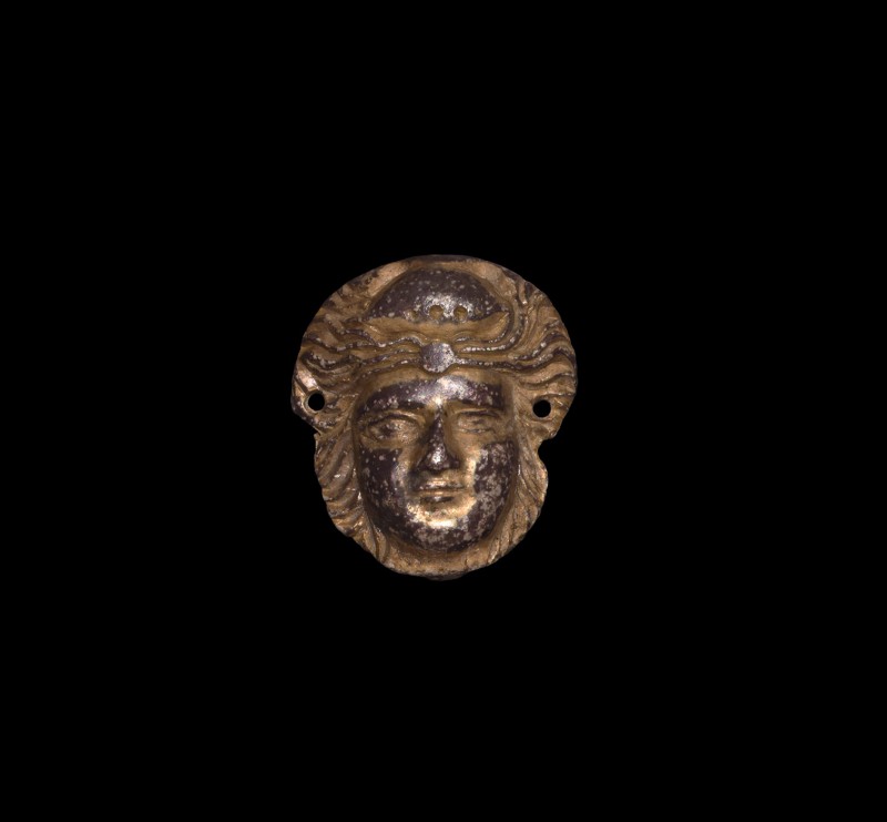 Roman Gilt Silver Face Mount
1st century BC-1st century AD. A silver-gilt mount...