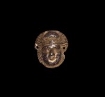 Roman Gilt Silver Face Mount
1st century BC-1st century AD. A silver-gilt mount, facing female mask with diadem and lateral attachment holes. 23 gram...