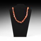 Roman or Parthian Carnelian Bead Necklace
3rd century BC-3rd century AD or later. A restrung necklace of graduated irregular carnelian beads, modern ...
