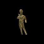 Roman Male Statuette
1st-2nd century AD. A bronze statuette of a standing nude male, modelled in the round; defined musculature, wavy hair tied behin...