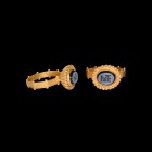 Byzantine Nicolo Intaglio with Monogram in Gold Ring
5th-6th century AD. A nicolo intaglio gemstone with monogram for 'MTEA' initials; set into a lat...
