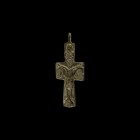 Byzantine Cross Pendant
10th-13th century AD. A bronze cross pendant with high-relief image of Corpus Christi with portrait of a saint above and to e...