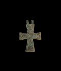 Byzantine Cross Pendant
6th-9th century AD. A bronze cruciform pendant with two pierced lugs, raised central panel, five ring-and-dot motifs. 33 gram...