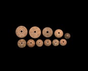 Byzantine Bone Spindle Whorl Group
6th-10th century AD. A mixed group of bone spindle whorls, each plano-convex with ring-and-dot and other geometric...