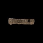 Byzantine Pewter Whistle
12th-14th century AD. A tubular lead-alloy whistle with flange to one end, the body with circumferential rings, scooped mout...