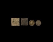 Byzantine Tabular Trade Weight Group
7th-10th century AD. A group of four bronze weights each with an incised cross and two capital letters to one fa...