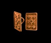 Byzantine Bread Stamp with Crosses
13th-15th century AD. A rectangular bronze stamp with voided lozenge and four crosses within a frame; loop handle ...