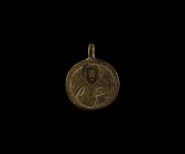 Byzantine Pendant of Saint Olaf
10th-13th century AD. A bronze discoid pendant with integral suspension lug, low relief image of a bearded nimbate fi...