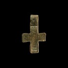 Byzantine Bone Inlaid Cross Pendant
6th-7th century AD. A bronze cruciform pendant with broad loop, inset curved bone plaque with vertical text '????...