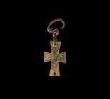 Byzantine Cross Pendant with Hanger
7th-9th century AD. A bronze cruciform pendant with expanding arms, pierced at each end, with two links form the ...