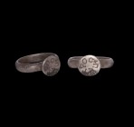 Byzantine Silver Ring for Peter
6th-8th century AD. A silver D-section hoop with raised round bezel, engraved with '+?????C' Greek Petros for Peter. ...