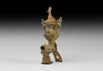 Byzantine Early Oil Lamp Attachment
8th-12th century AD. A bronze lamp element comprising an amphora-shaped well with lateral strap arms and knop fin...