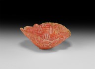 Byzantine Glass Oyster-Shell Bowl
6th-8th century AD. A squat glass bowl with pinched rim, the body with latticework effect in coral pink and white. ...