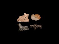 Western Asiatic Amulet Collection
1st millennium BC. A group of four bead amulets in schist, agate and other stones. 39 grams total, 30-36mm (1 1/4 -...