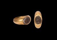 Western Asiatic Sassanian Gold Ring with Portrait Gemstone
3rd-7th century AD. A hollow-form gold ring comprising a D-section hoop with tapering shou...