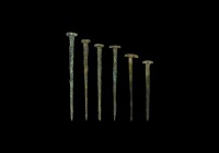 Western Asiatic Seal-Topped Pin Group
Late 3rd millennium BC. A mixed group of bronze dress pins, each with tapering shank and rosette finial, includ...