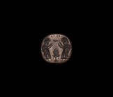 Western Asiatic Stamp Seal with Offering Scene
1st millennium BC. A discoid stamp seal with loop to the reverse, intaglio pair of opposed robed figur...