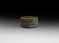 Western Asiatic Palmette Bowl
1st millennium AD. A sheet bronze bowl with domed base, band of repoussé palmettes between ropework bands to the sidewa...