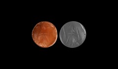 Western Asiatic Large Elamite Stamp Seal
2nd millennium BC. A carnelian dome-shaped stamp seal engraved to the underside with a series of engraved li...
