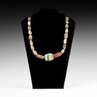 Western Asiatic Banded Agate Bead Necklace
3rd century BC-3rd century AD and later. A restrung necklace of mainly fusiform banded agate beads with ce...