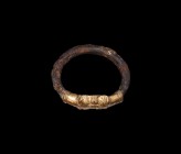 Western Asiatic Gold Clad Bangle
1st millennium BC. An iron bangle with sheet-gold panel of two opposed lion-masks, each with ropework collar and rep...