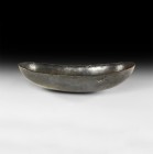 Western Asiatic Sassanian Boat-Shaped Silver Bowl
6th-7th century AD. A silver oval bowl with flat rim, rounded body and base. For a similar example ...