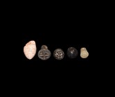 Western Asiatic Pendant Group
1st millennium BC. A mixed group of chalcedony, limestone and composition pendants with pierced suspension lugs. 24.78 ...