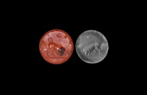 Western Asiatic Sassanian Stamp Seal with Bull
3rd-7th century AD. A carnelian stamp seal with domed body; underside engraved with a butting bull wit...