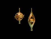 Western Asiatic Amlash Pendant Group
1st millennium BC. A pair of bronze fittings consisting of: a discoid with cross to centre with roundels to the ...