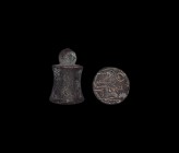 Western Asiatic Stamp Seal with Flaming Altar
1st millennium BC. A bronze cylindrical seal with narrow waist, suspension loop above; underside engrav...