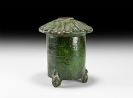 Chinese Ming Glazed Store Model
Ming Dynasty, 1368-1644 AD. A green-glazed ceramic model of a storage building, drum-shaped with three zoomorphic fee...