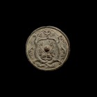 Chinese Tang Mirror with Entwined Dragons
Tang Dynasty, 618-906 AD. A bronze mirror with lobed rim, decorative frieze depicting two entwined dragons ...