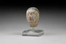Chinese Han Terracotta Head
Han Dynasty, 206 BC-220 AD. A painted terracotta head from a figurine with hair swept back from the face, centre parting;...