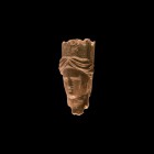 Central Asian Head Statue Fragment
1st millennium AD. A carved bone tubular fragment from a figurine with female face and dressed hair and tall headd...
