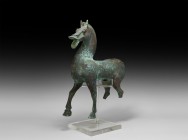 Chinese Han Bronze Statue of a Horse
Han Dynasty, 206 BC-220 AD. A bronze figurine of a horse standing in advancing pose with detailed musculature to...