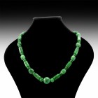 Chinese Jade Bead Necklace
Early 20th century AD. A necklace of cylindrical jade beads with scroll and cash-coin detailing, barrel-shaped beads with ...