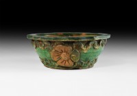 Chinese Ming Glazed Bowl
Ming Dynasty, 1368-1644 AD. A green-glazed ceramic bowl with basal ring, applied bands of running swags, flared rim; provinc...
