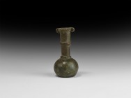 Chinese Han Bronze Vessel
Han Dynasty, 206 BC-220 AD. A bronze vessel with bulbous body, tapering neck with three collars, lateral loops to the rim. ...