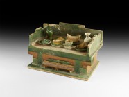 Chinese Ming Table and Fruit Offering
Ming Dynasty, 1368-1644 AD. A hollow glazed ceramic offering table with two miniature ewers, dishes with pig's ...