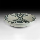 Chinese Blue and White Charger
16th-17th century AD. A broad glazed ceramic dish with blue concentric rings and floral motifs; provincial work. 1.6 k...
