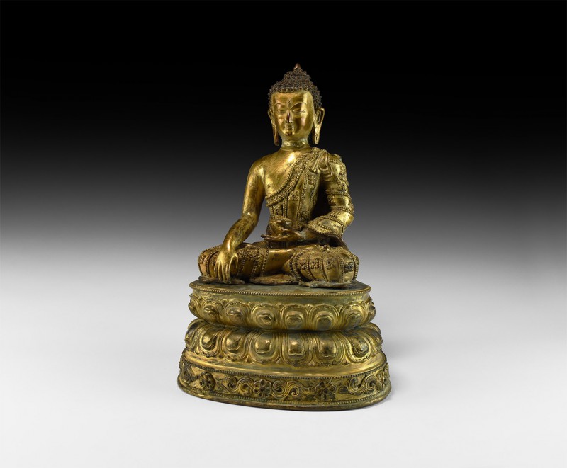 Sino-Tibetan Gilt Buddha Figure on Stand
20th century AD. A hollow-formed gilt-...