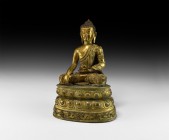 Sino-Tibetan Gilt Buddha Figure on Stand
20th century AD. A hollow-formed gilt-bronze figure of Buddha sitting cross-legged on a lotus-flower base wi...