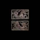Chinese Ordos Animal Plaque Pair
Ordos Culture, 6th-2nd century BC. A pair of bronze rectangular plaques each with herringbone frame, openwork zoomor...