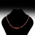 Chinese Bead Necklace String
18th-19th century AD. A restrung necklace of near-transparent carnelian tiered tubular beads with two facetted bottle-sh...