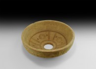 Large Gandharan Ceramic Bowl Mould
2nd-4th century AD. A ceramic mould for decorated bowls with large central hole, radiating bands of billets with l...