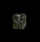 Indian Carved Elephant Amulet
20th century AD. A carved nephrite jade pendant of an elephant in profile pierced at the trunk. 2.58 grams, 17mm (3/4")...