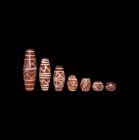 Indus Valley Etched Carnelian Bead Collection
3rd millennium BC or later. A group of stone conical and spheroid beads, each engraved with lines and d...